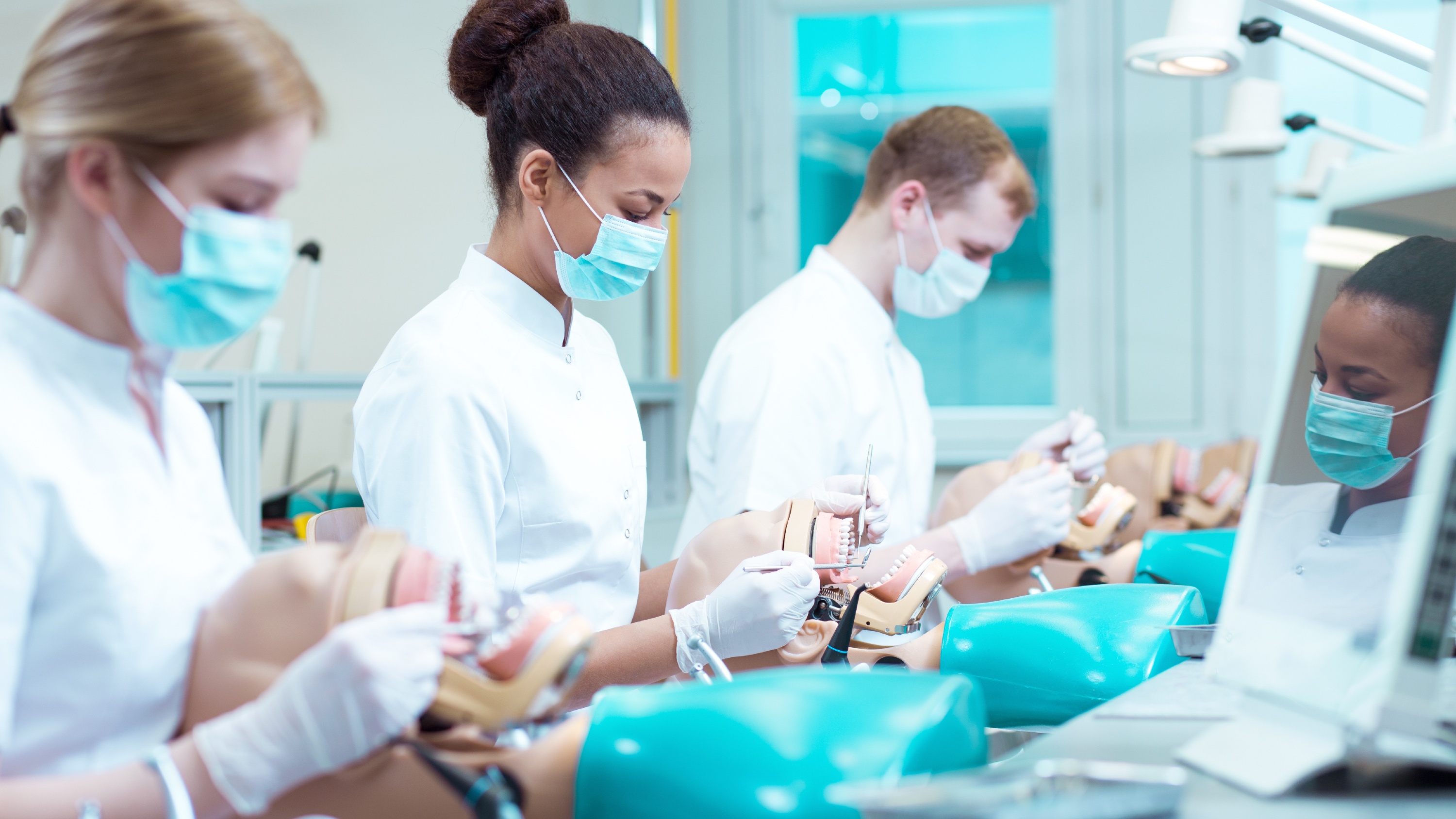Dentistry apprentices work on dummies